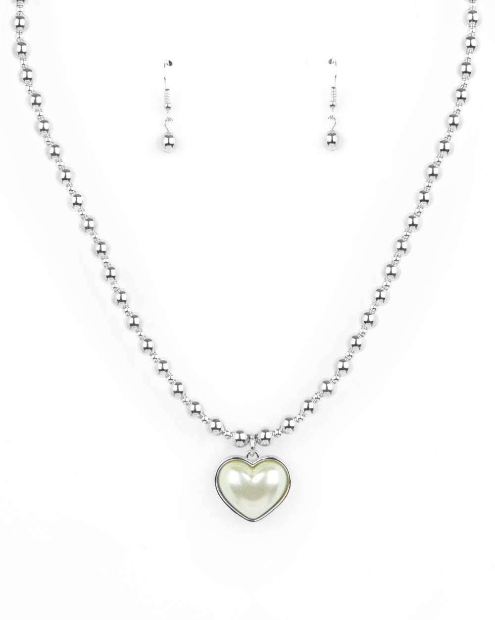 N1667
Featuring a pearly Green Ash center, a charming heart pendant glides along a strand of silver beads below the collar for a romantic flair. Features an adjustable clasp closure.